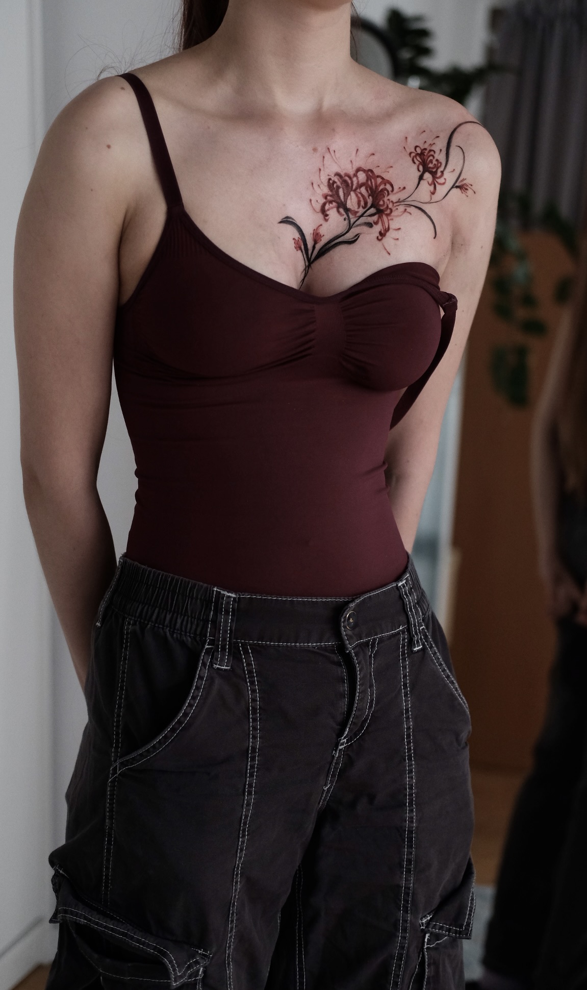 Spider lilly tattoo on the chest