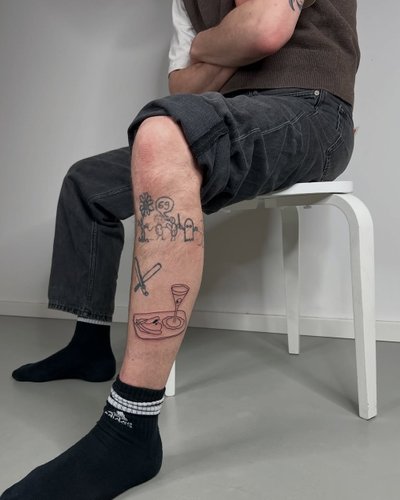 Illustrative Schienbein-Tattoos im Fineline Style auf Schienbein von offstudio_leipzig in Leipzig