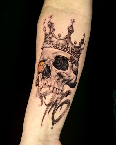 Totenkopf des Königs in Black & Gray style on Forearm by Won Ink Hamburg