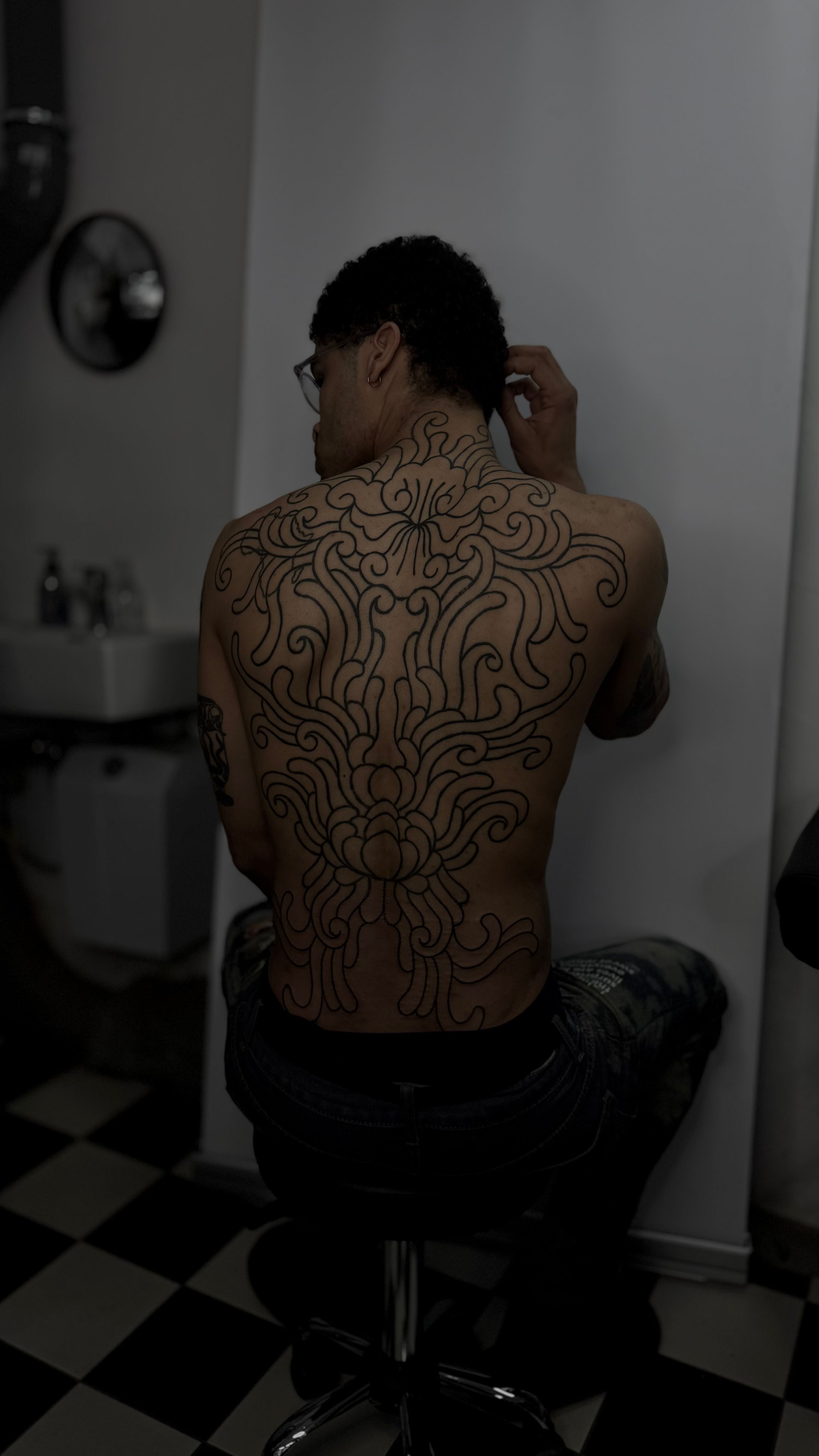 ornamental chrysanthemum inspired backpiece in style on Back by studio gamine Freiburg im Breisgau