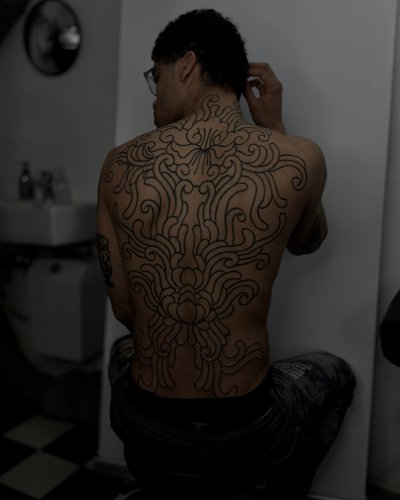 ornamental chrysanthemum inspired backpiece in style on Back by studio gamine Freiburg im Breisgau