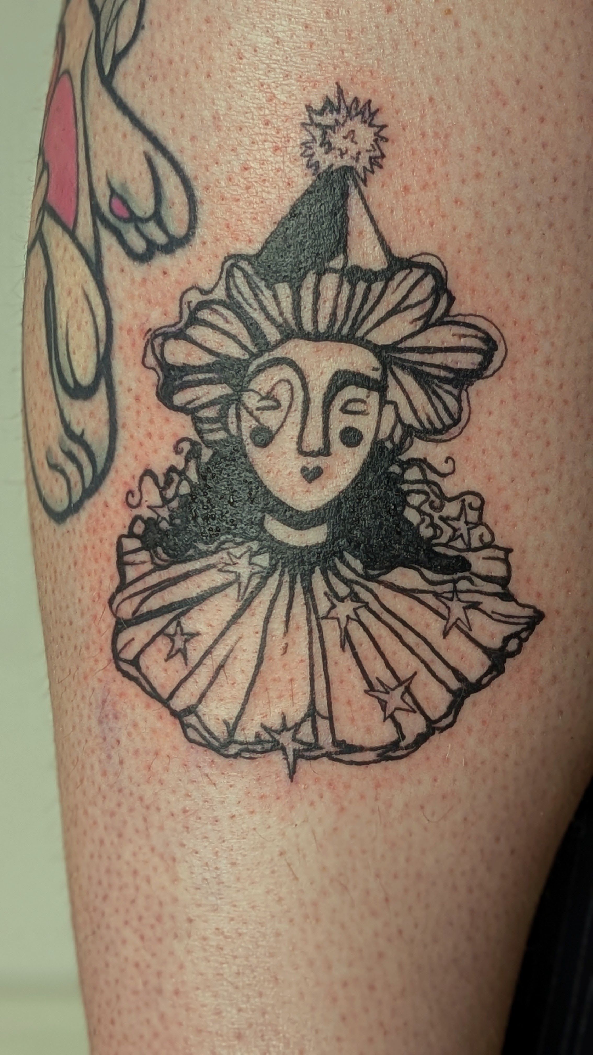 whimsical Zirkus Clown in Blackwork style on Leg by janus_tattoo Hamburg