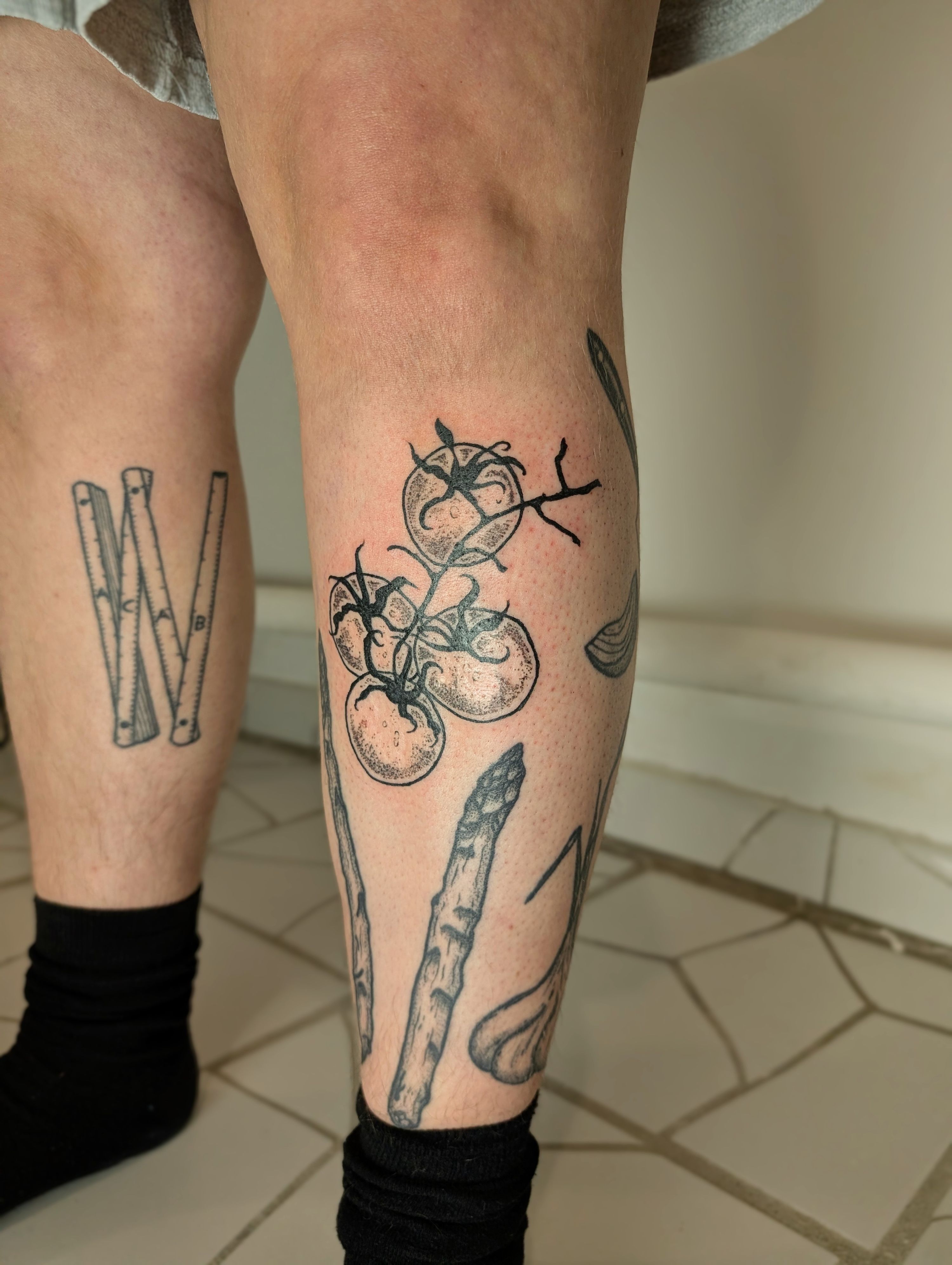 Tomaten in Line Work style on Shin by janus_tattoo Hamburg