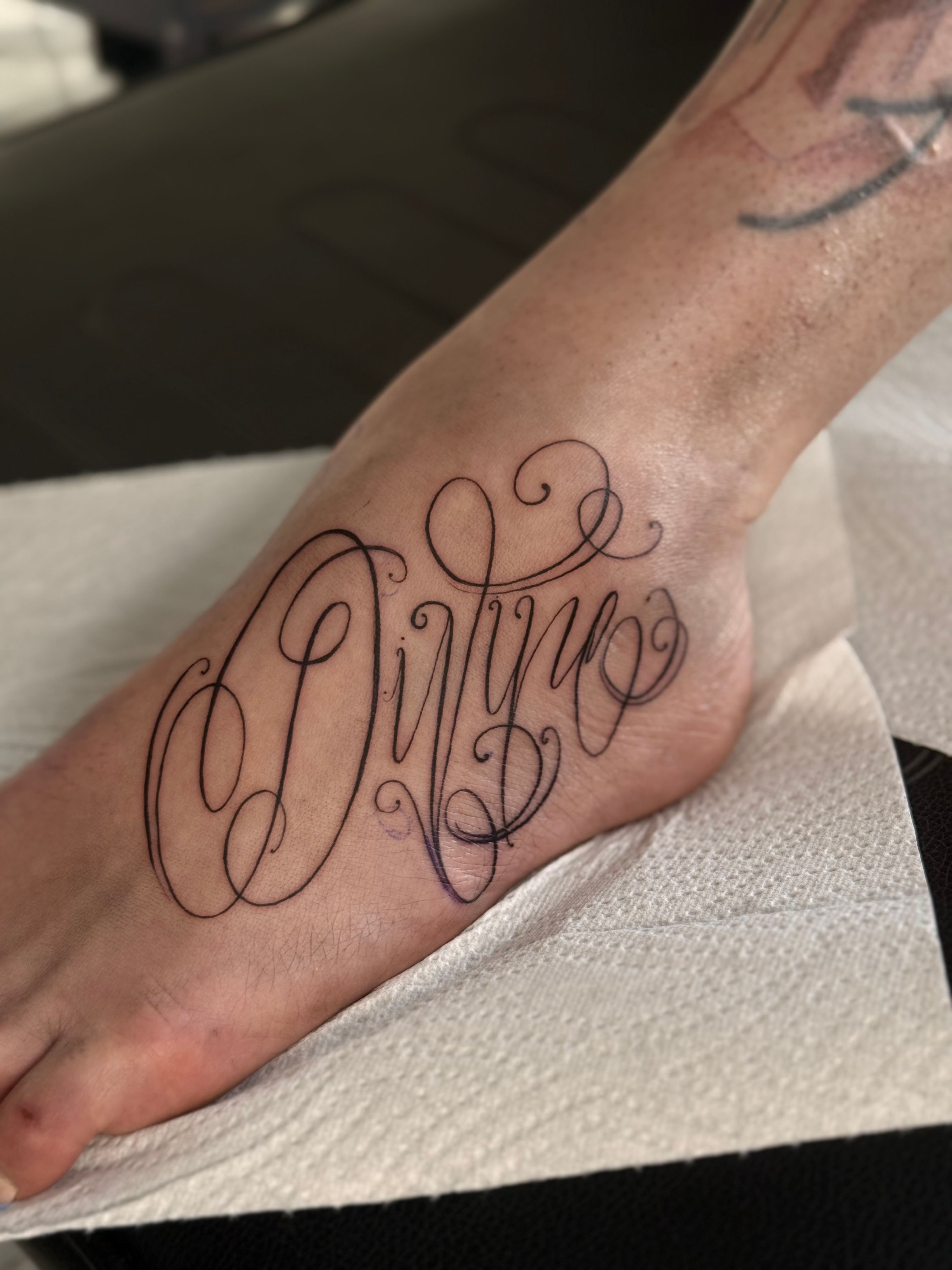 Fineline Lettering in Small style on Foot by Solution Ink Wildau