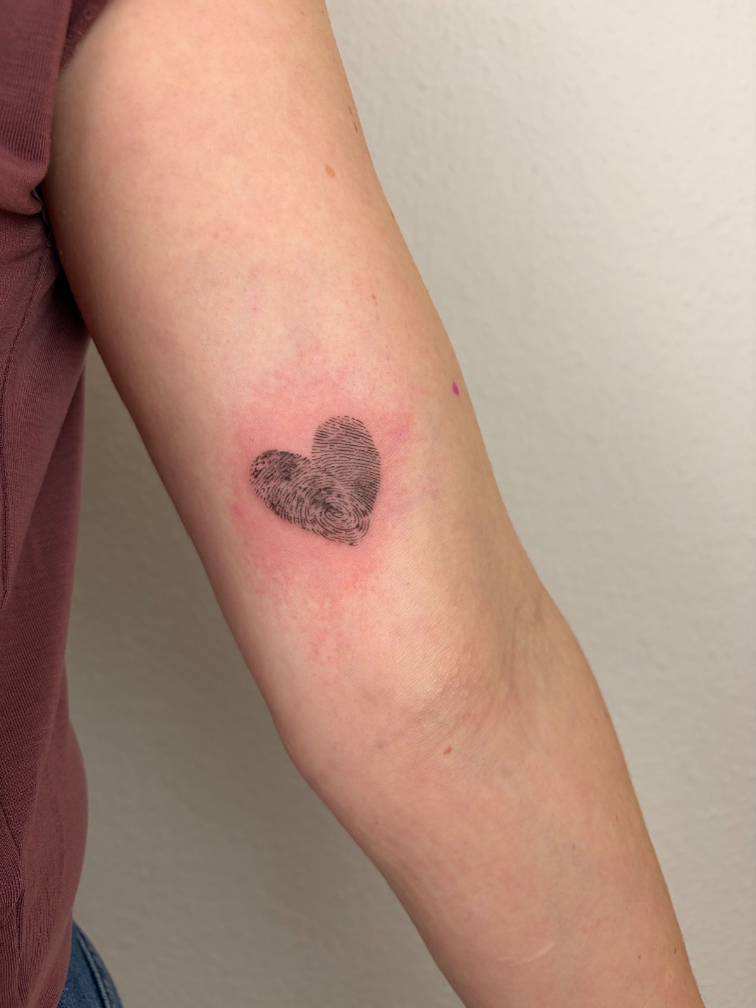 Fingerprints in Fineline style on Upper Arm by Sadmeply Tattoo Hamburg