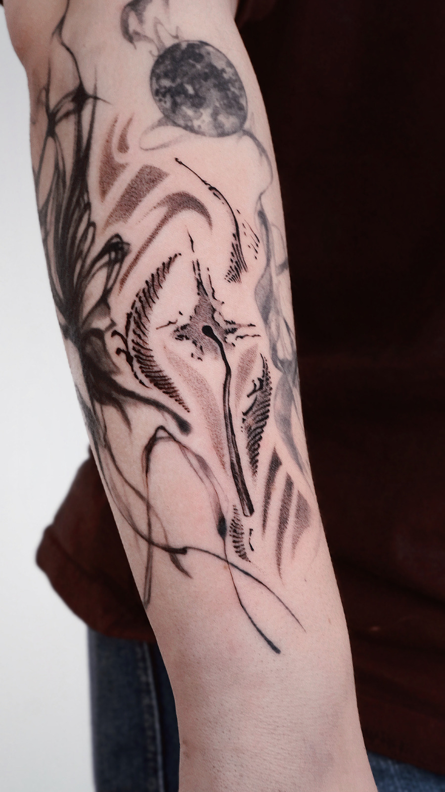 Matchstick with abstract elements in Black & Gray style on Forearm by Lucas Leipzig