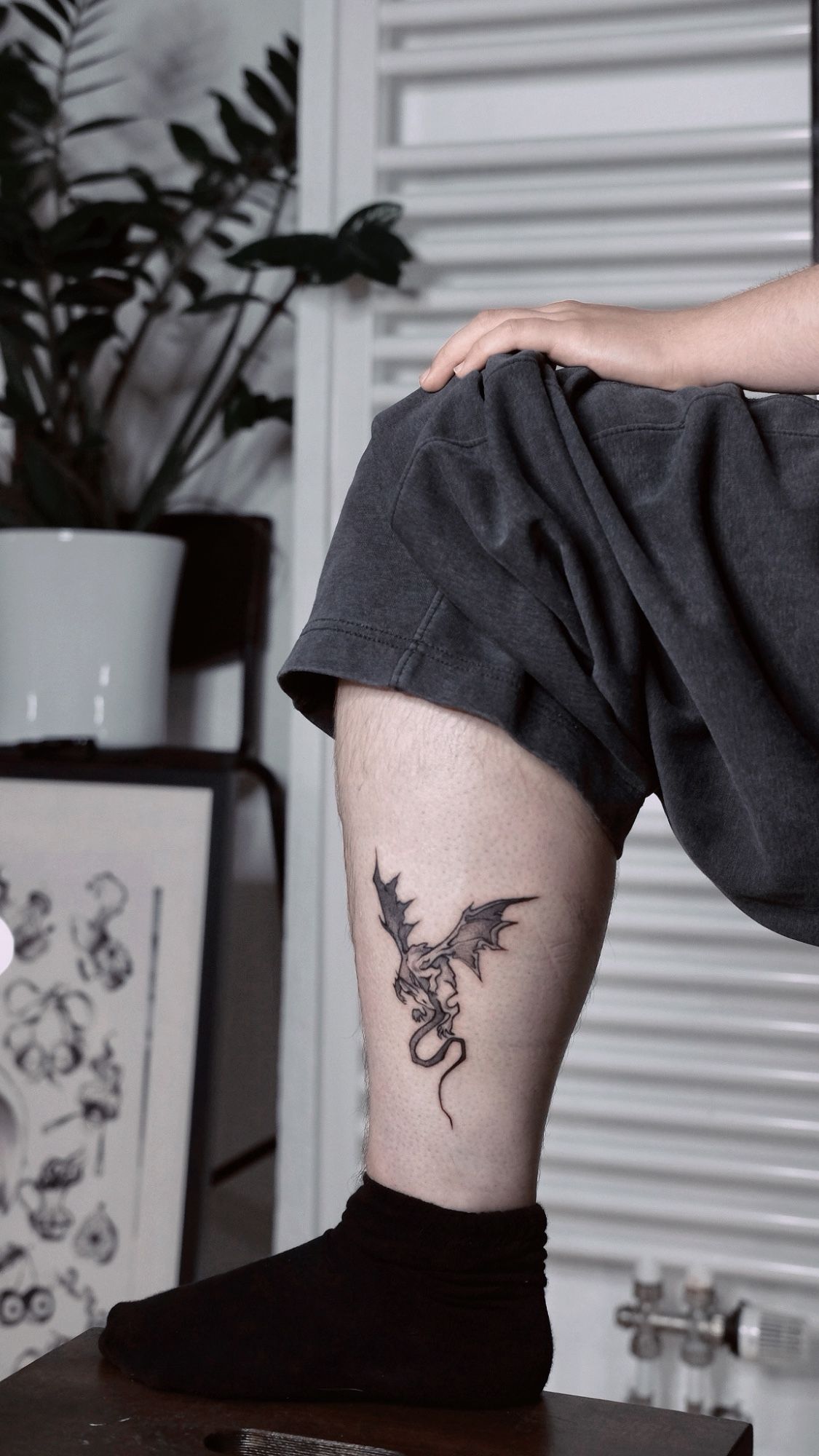 Dragon tattoo in Illustrative style on Ankle by Atelier tat Leipzig