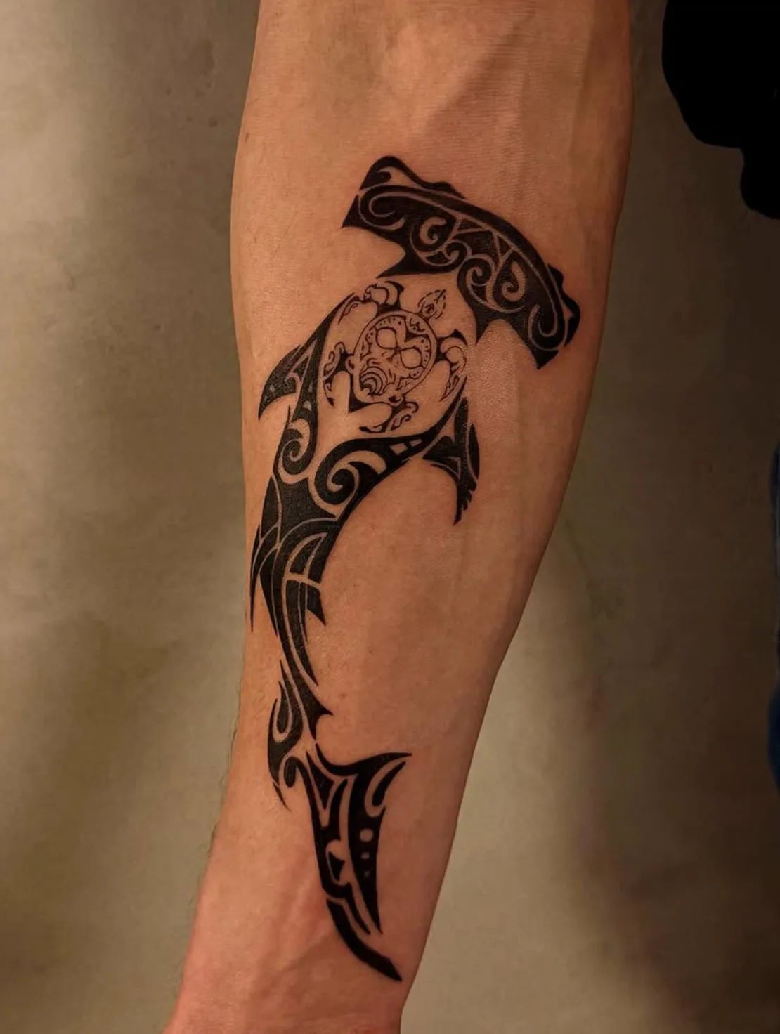 Maori hammerhead shark tattoo with turtle on forearm