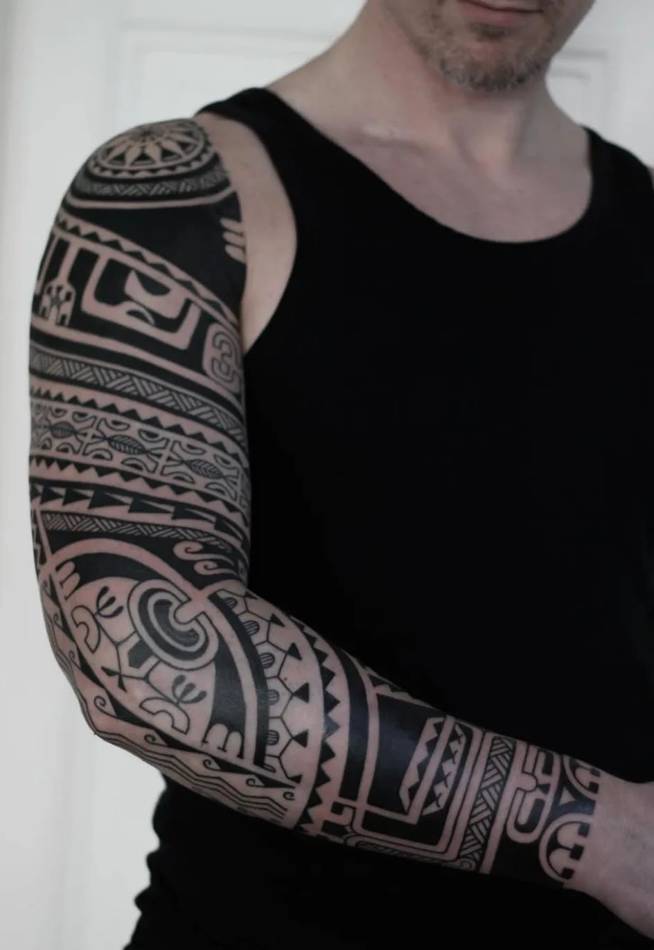 Maori blackwork full sleeve tattoo on a man's arm
