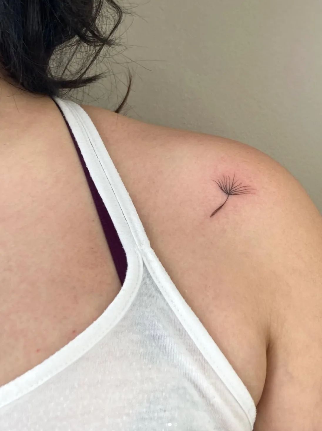 Fine line dandelion tattoo on shoulder
