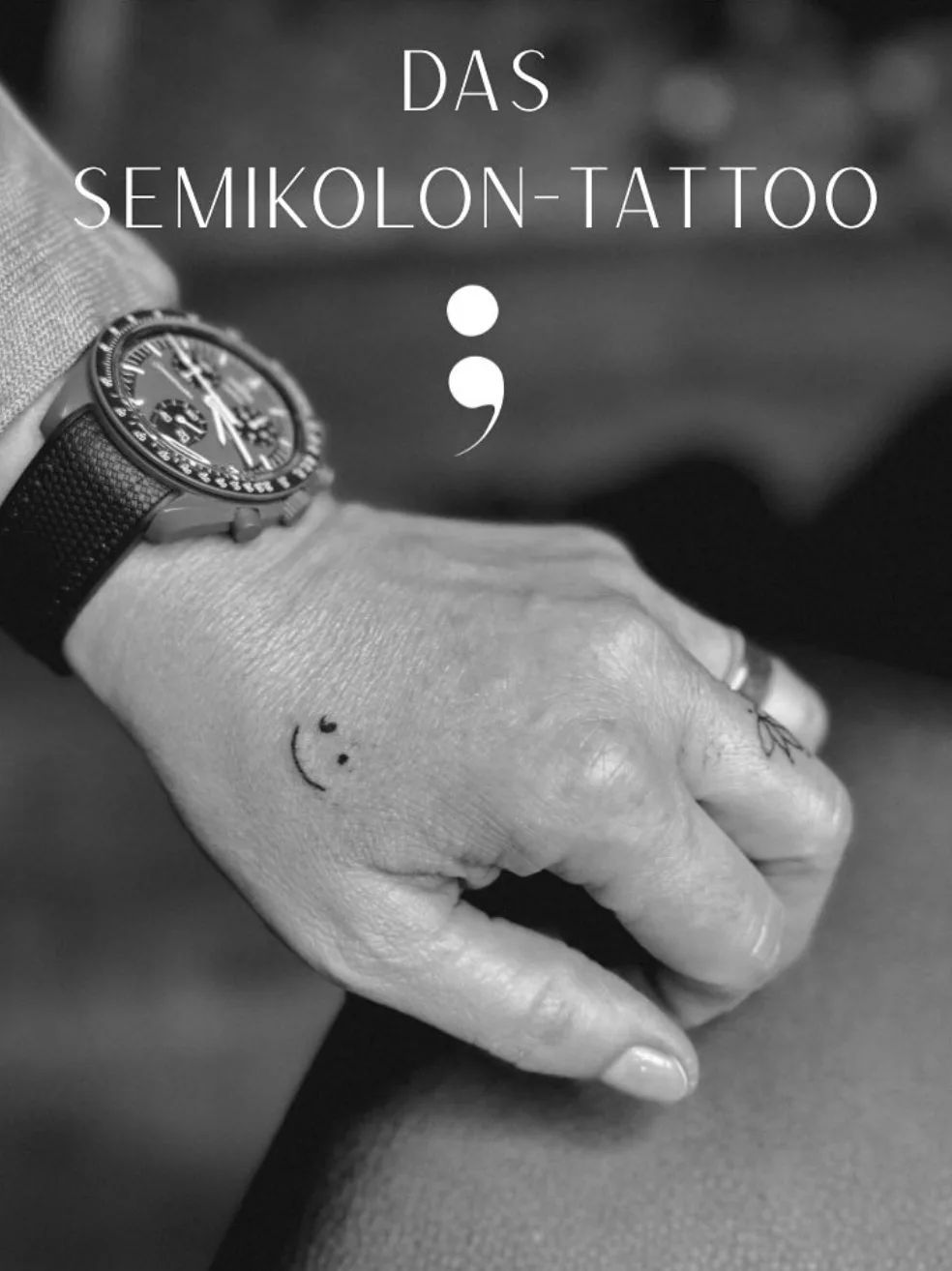 Fine line smiley tattoo on the back of the hand, semicolon tattoo style