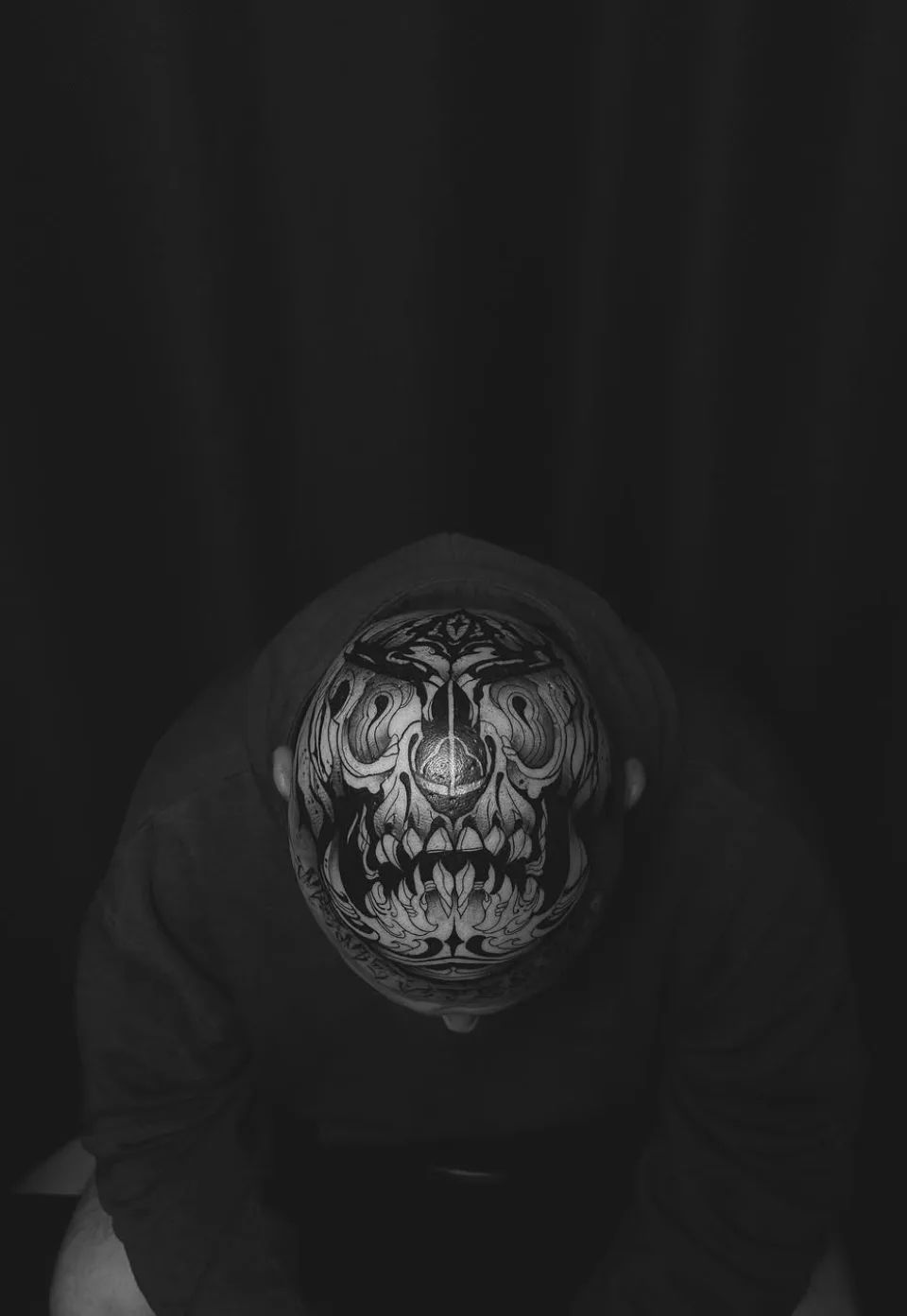 Skull tattoo in blackwork style on head